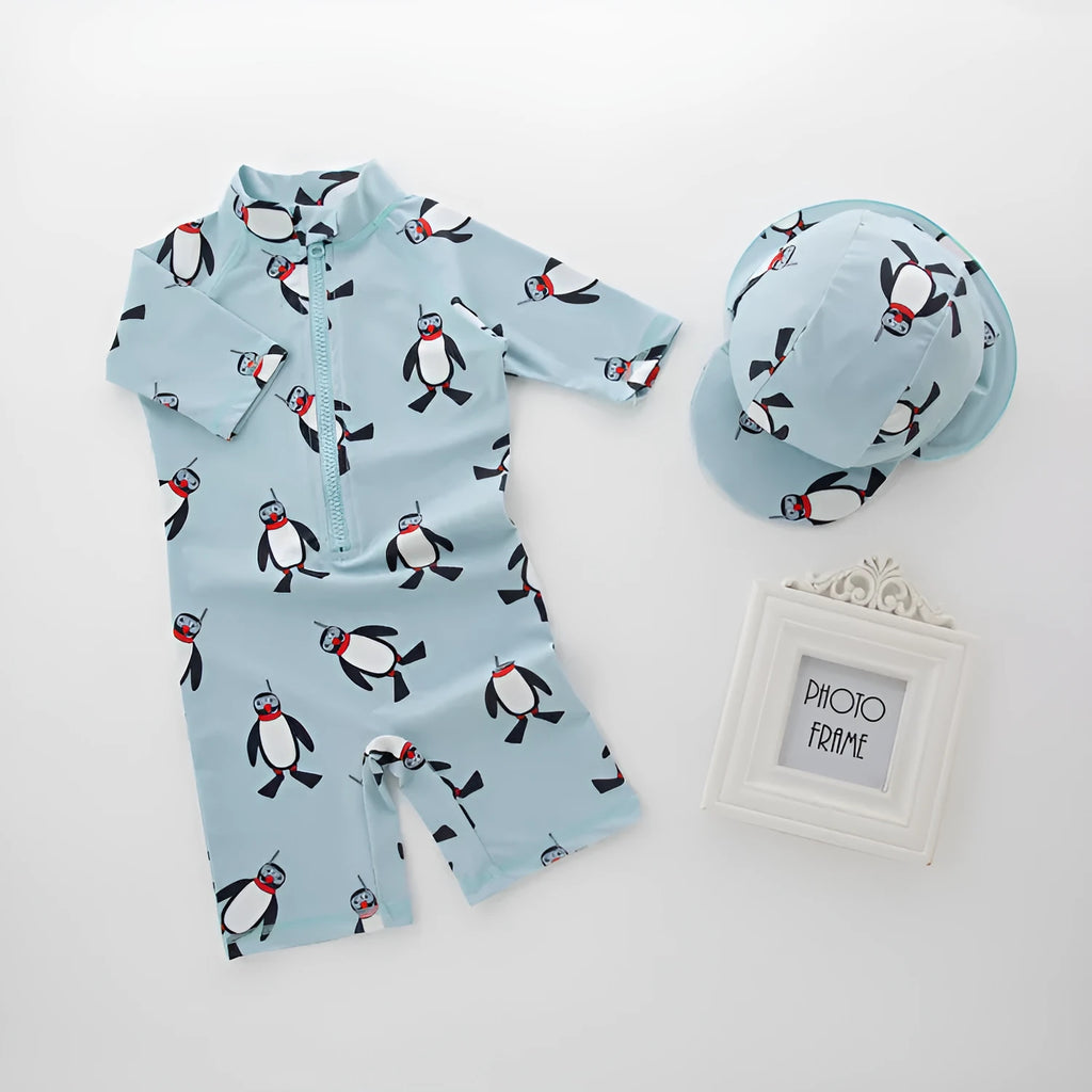 Boys' penguin print long sleeve one-piece swimsuit with matching swimming cap