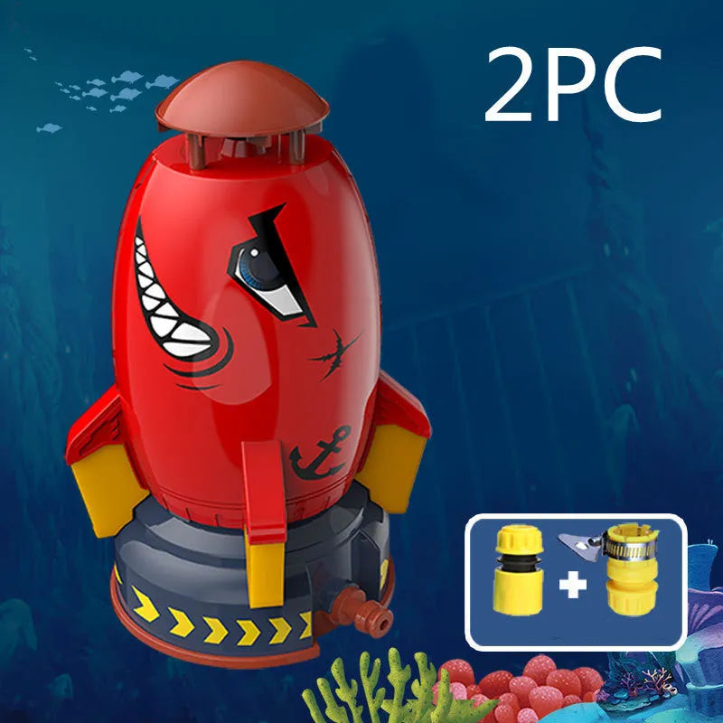 Water pressure rocket launcher toy on green grass with water spray, yellow rocket, and base connector
