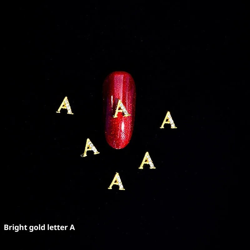 Gold alloy letter A nail ornament charm with crystal detail on a square chain base
