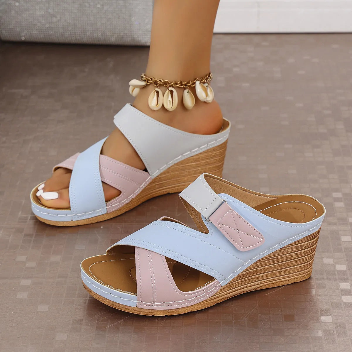 Women's black and white wedge platform slippers with a Velcro strap and open fish mouth toe.