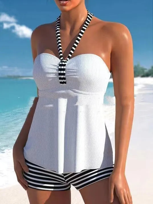 Women's off-shoulder one-piece swimsuit in solid white and black/white striped patterns.