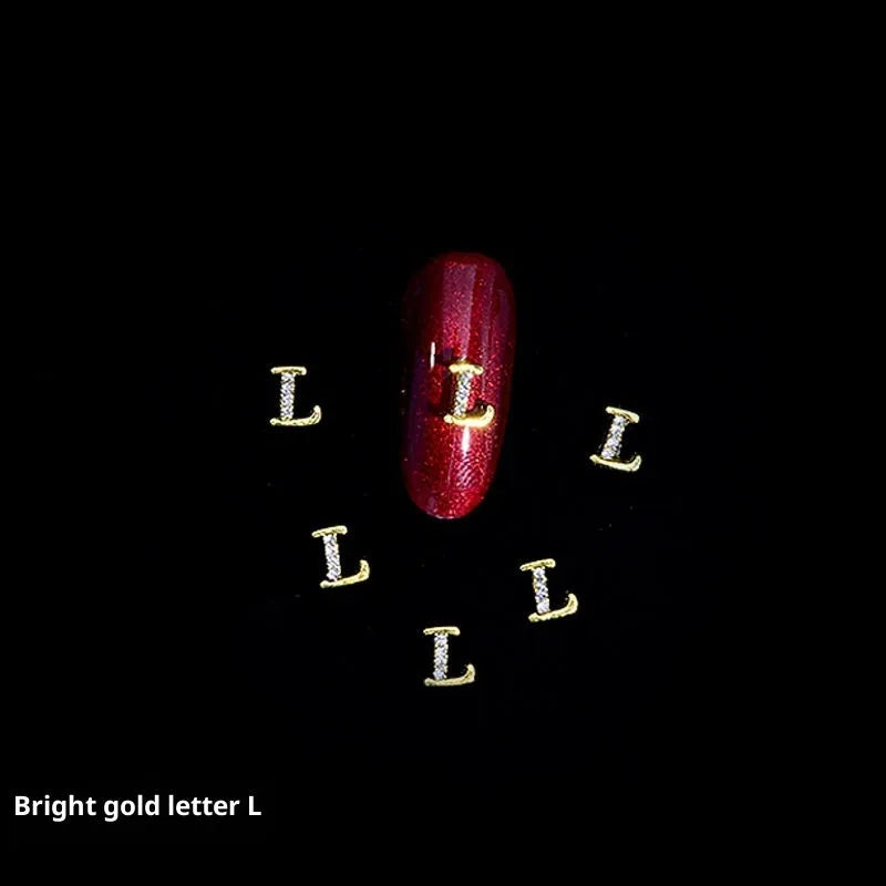Gold alloy letter A nail ornament charm with crystal detail on a square chain base