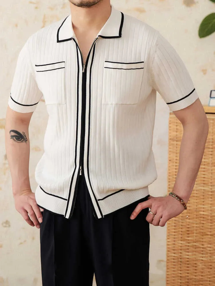 Slim-fit man's knitted polo shirt with a lapel collar and short sleeves in a black viscose blend fabric.