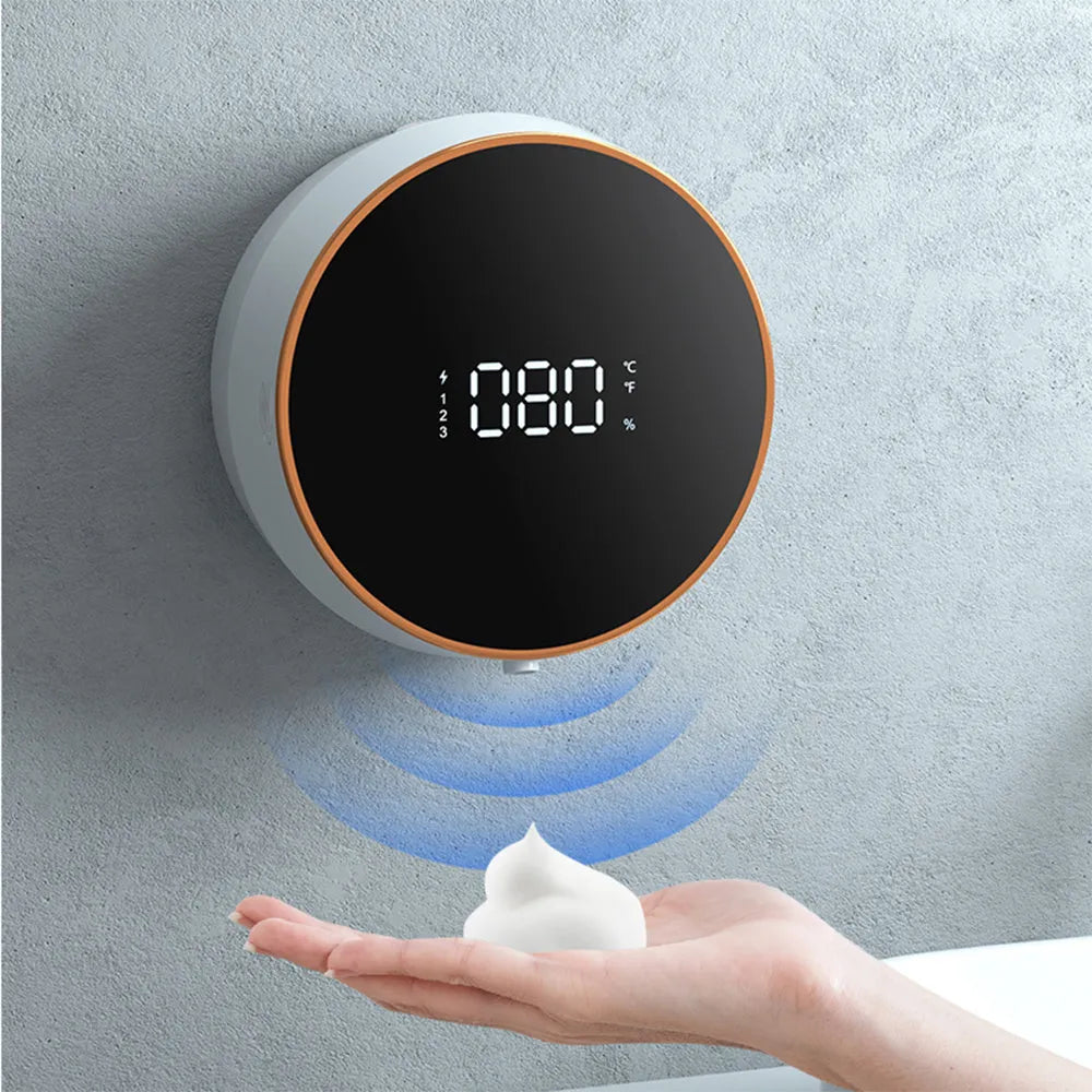 Black and white automatic foam soap dispenser with USB charging port mounted on wall