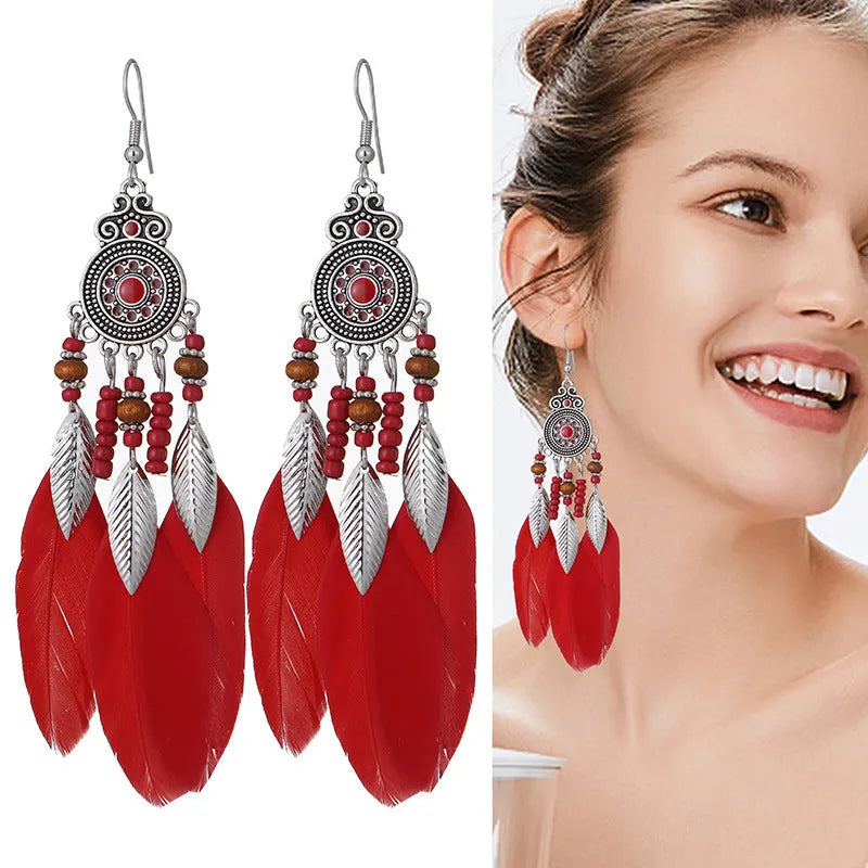 Round drop feather design alloy earrings with leaf pattern in a bohemian style, showing electroplated finish.