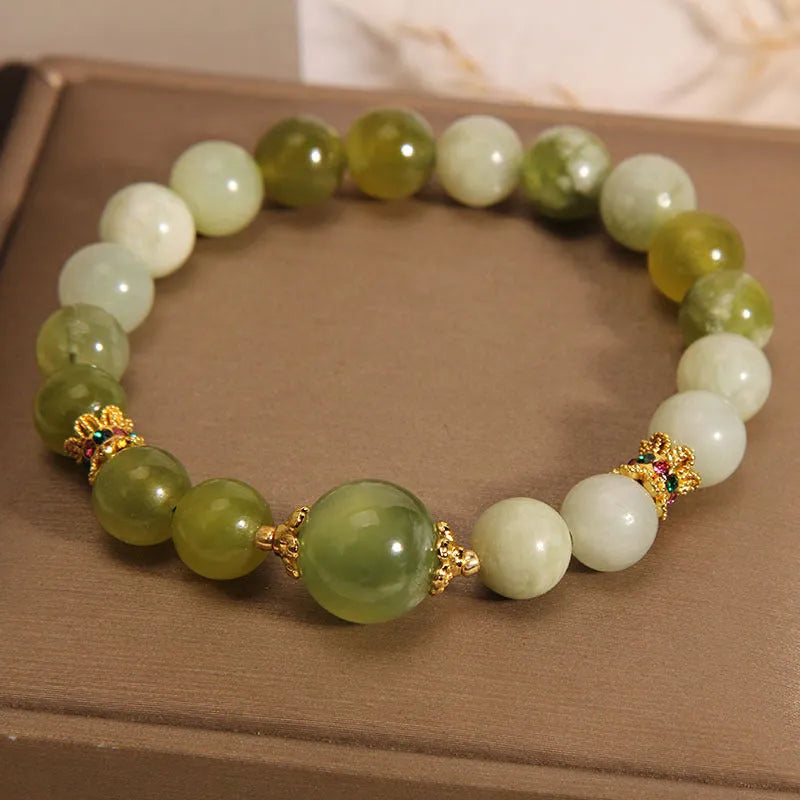 Women's green Xiuyan jade bracelet with an original sweet Mori style design.