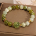 Women's green Xiuyan jade bracelet with an original sweet Mori style design.
