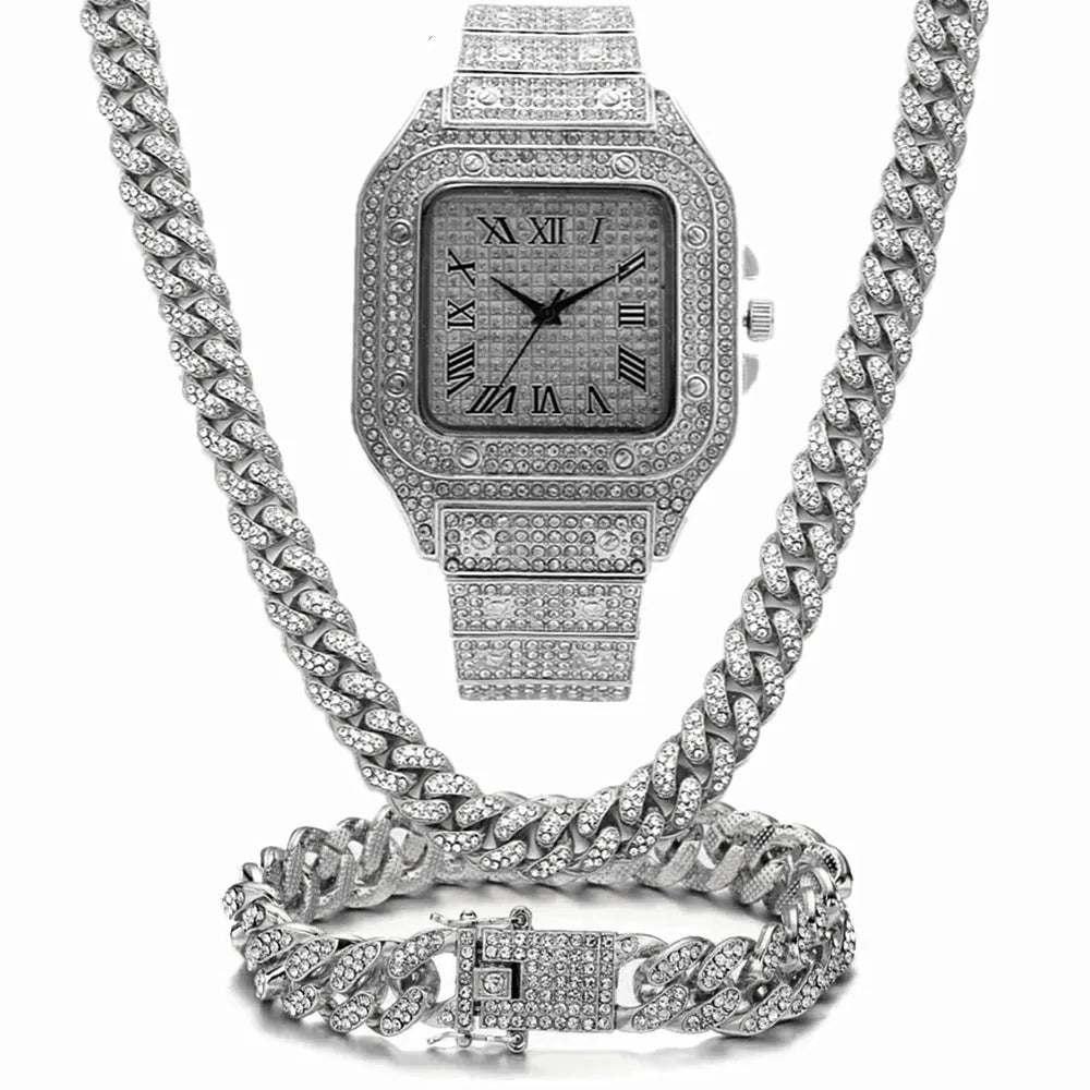 Gold Roman numeral quartz watch with diamond studs and black mesh band, with matching bracelet and necklace.