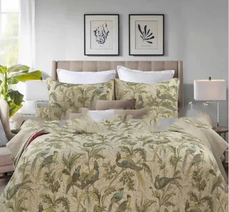 Blue American floral pattern cotton quilted bedspread set with three pieces on a bed
