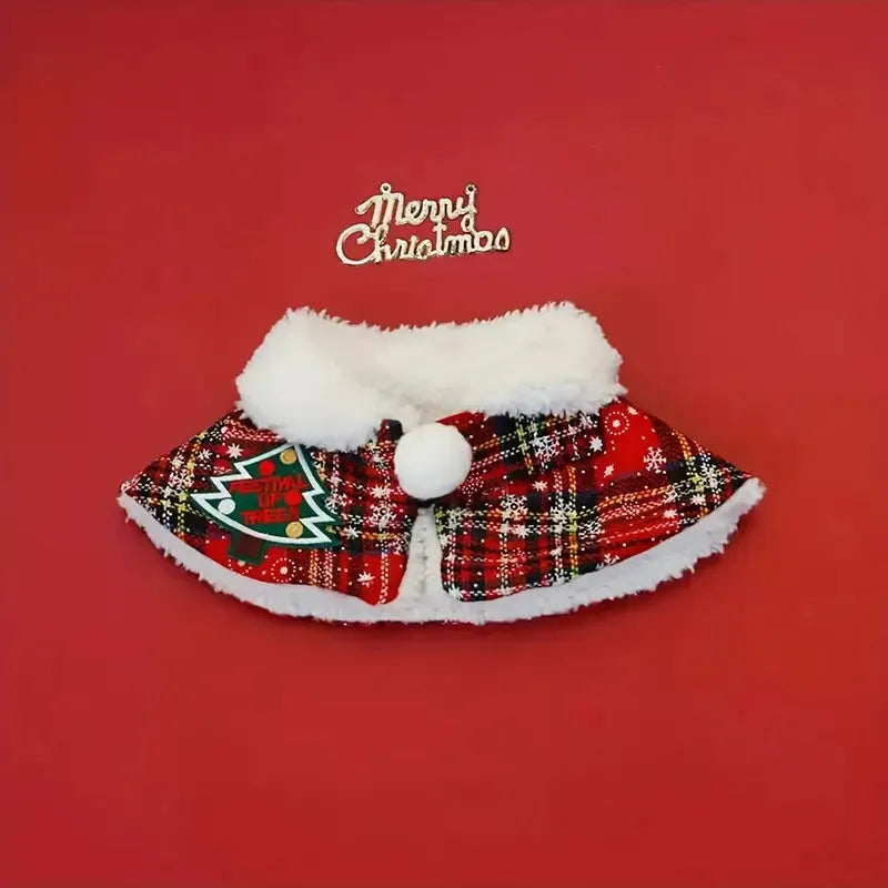 Polyester pet scarf cloak on a dog, showing a red background with a festive snowflake bell design.