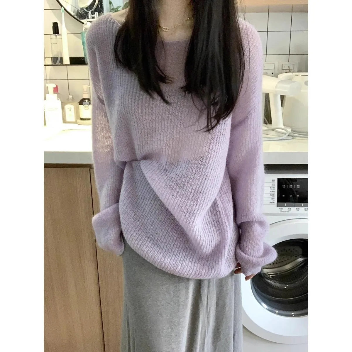 Purple sleeveless blouse with princess sleeves and hollow-out detail, made from lightweight ice silk fabric.