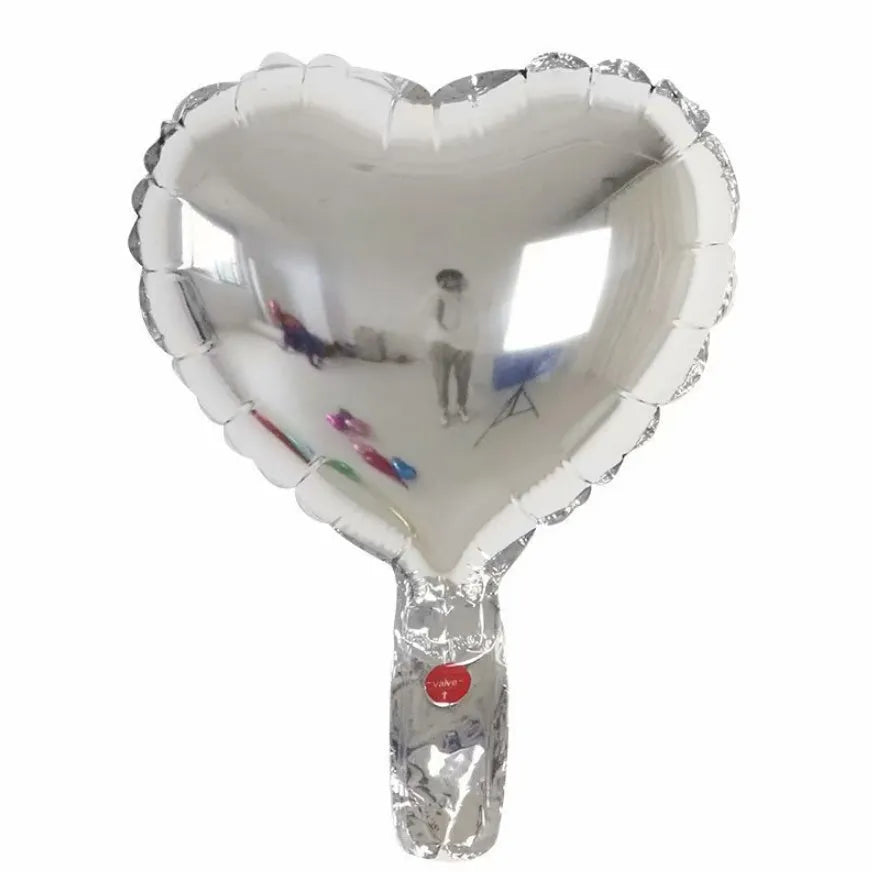Five sparkling peach heart shaped aluminium balloons in assorted colours for party decoration.