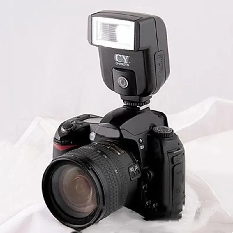 Compact SLR camera flash unit with 90-degree tilt adjustment shown mounted on camera