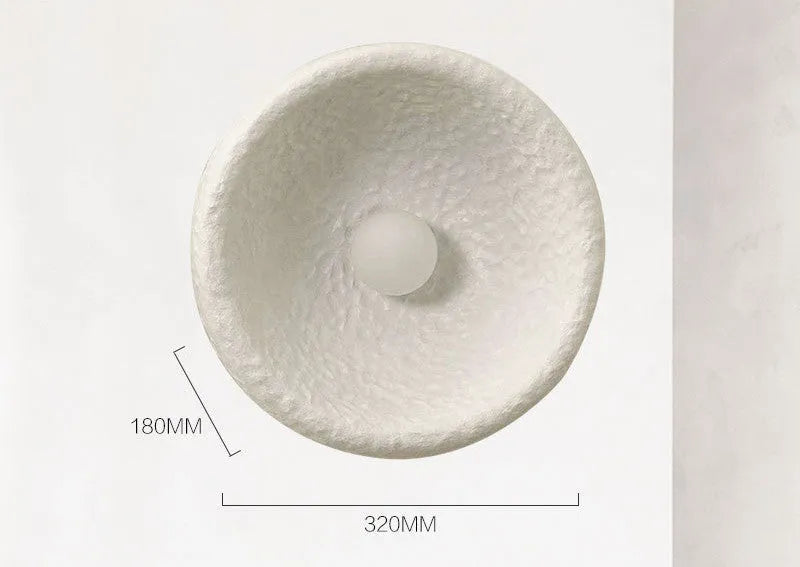 Japanese-style minimalist resin wall lamp in warm light, showing size options.