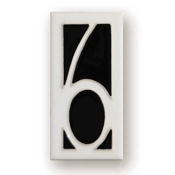 Handmade retro enamel ceramic doorplate showing a number on a glossy surface