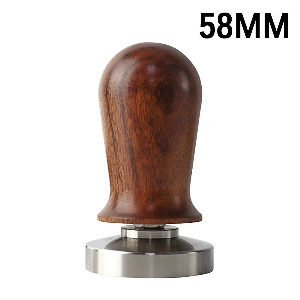 Black silicone coffee tamper pad with stainless steel base for non-slip espresso preparation
