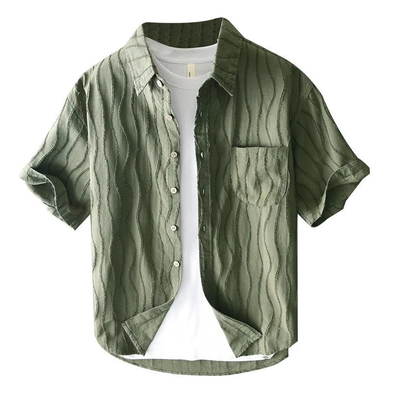 Man wearing a loose fit apricot coloured pure cotton short sleeve casual shirt