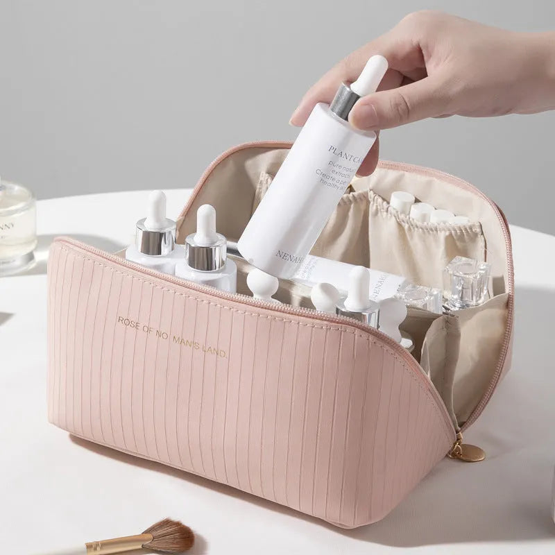Beige cubic PU vertical pattern pillow makeup bag for travel, showing dimensions of 22.5cm by 12.5cm.