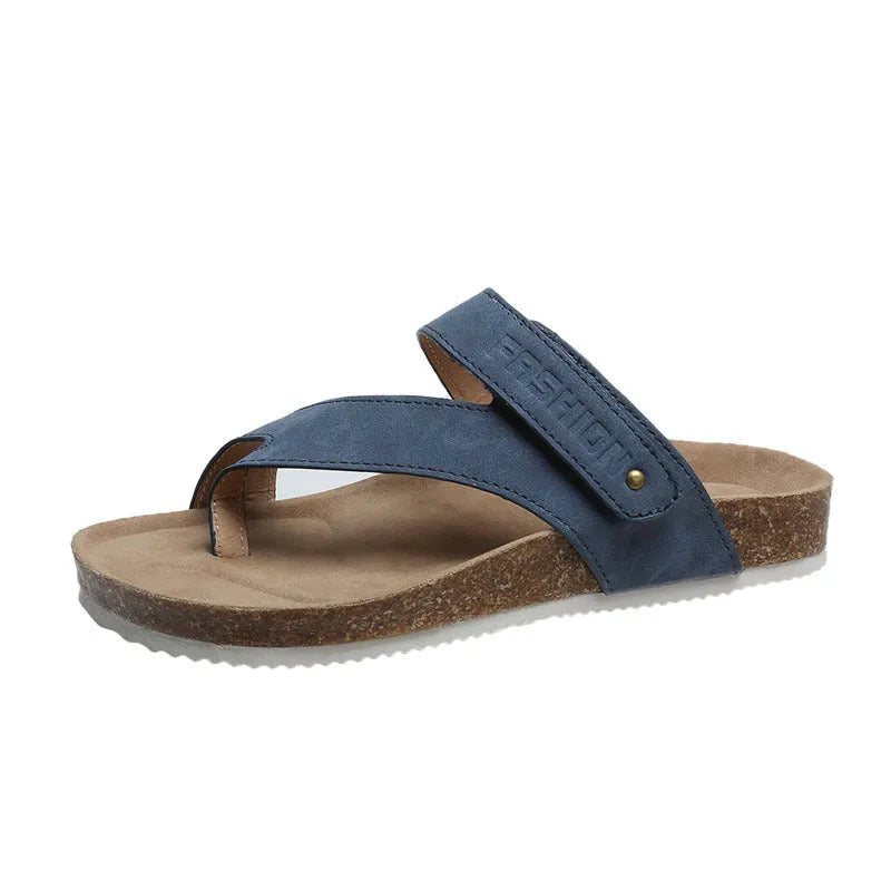 Flat toe ring thick-soled flip-flop in a solid colour on a plain background
