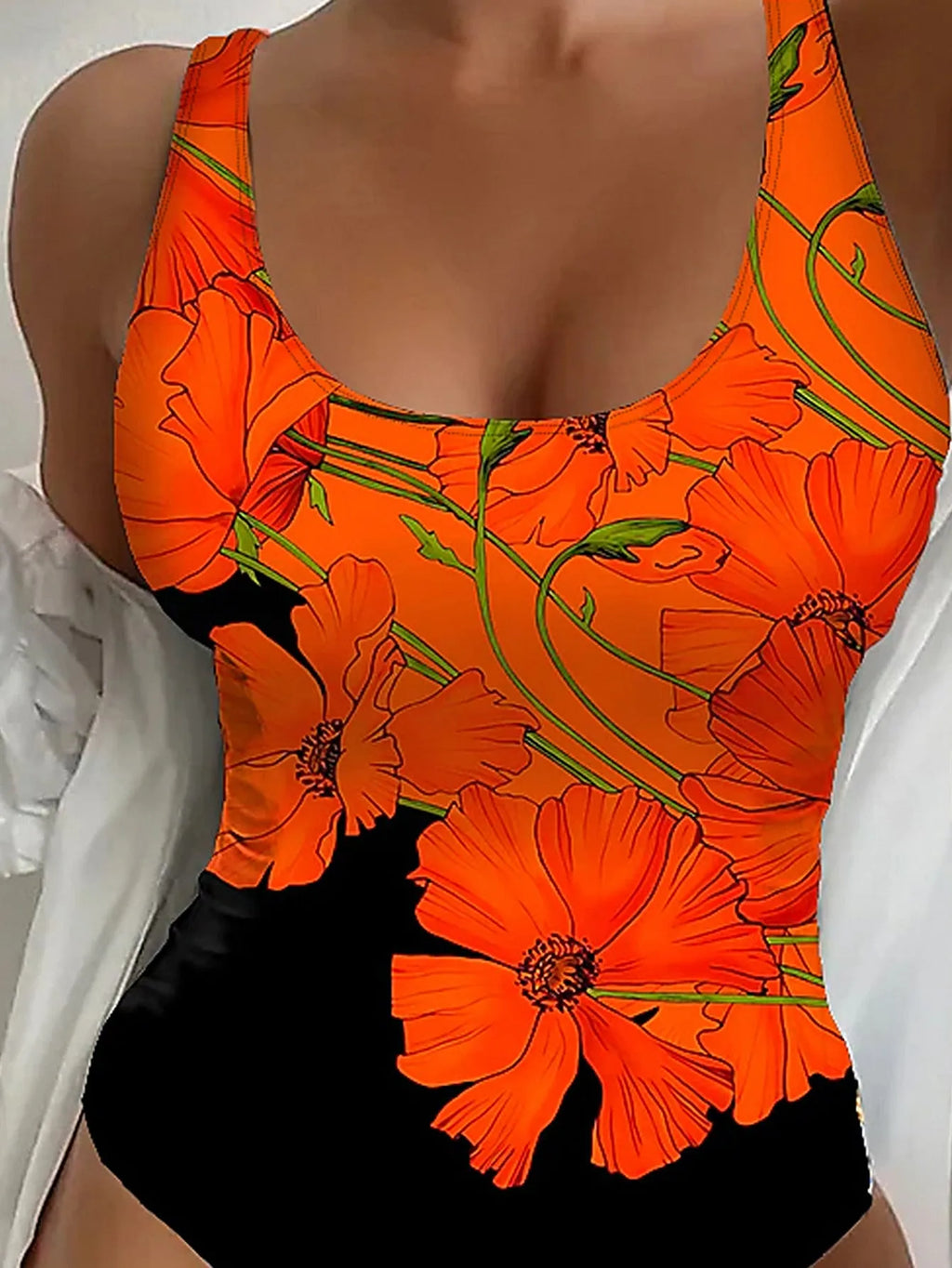 Orange floral print women's backless one-piece swimsuit on a white background.