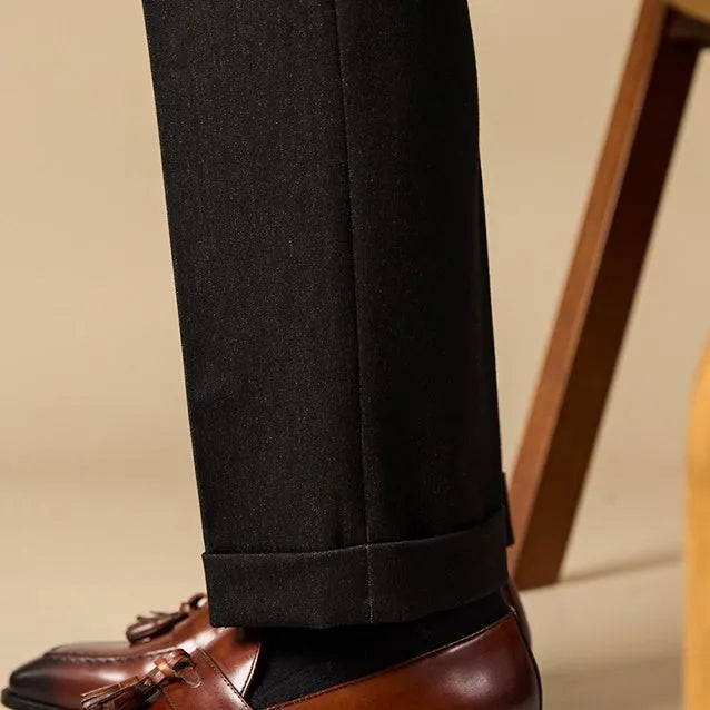 Men's black and brown polished leather tassel loafers with pigskin lining and rubber soles