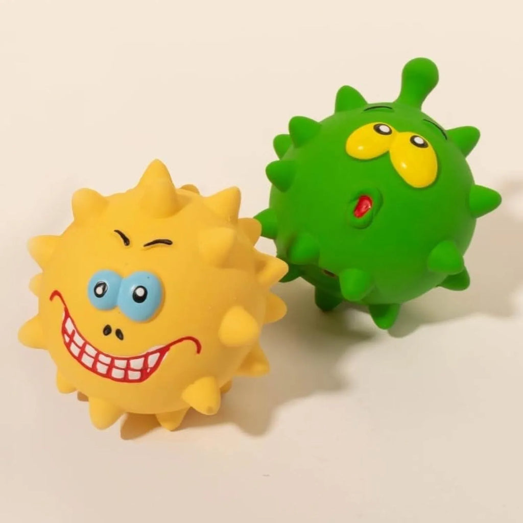 Set of four colourful latex squeaky dog balls with cute faces on bumpy textured surfaces