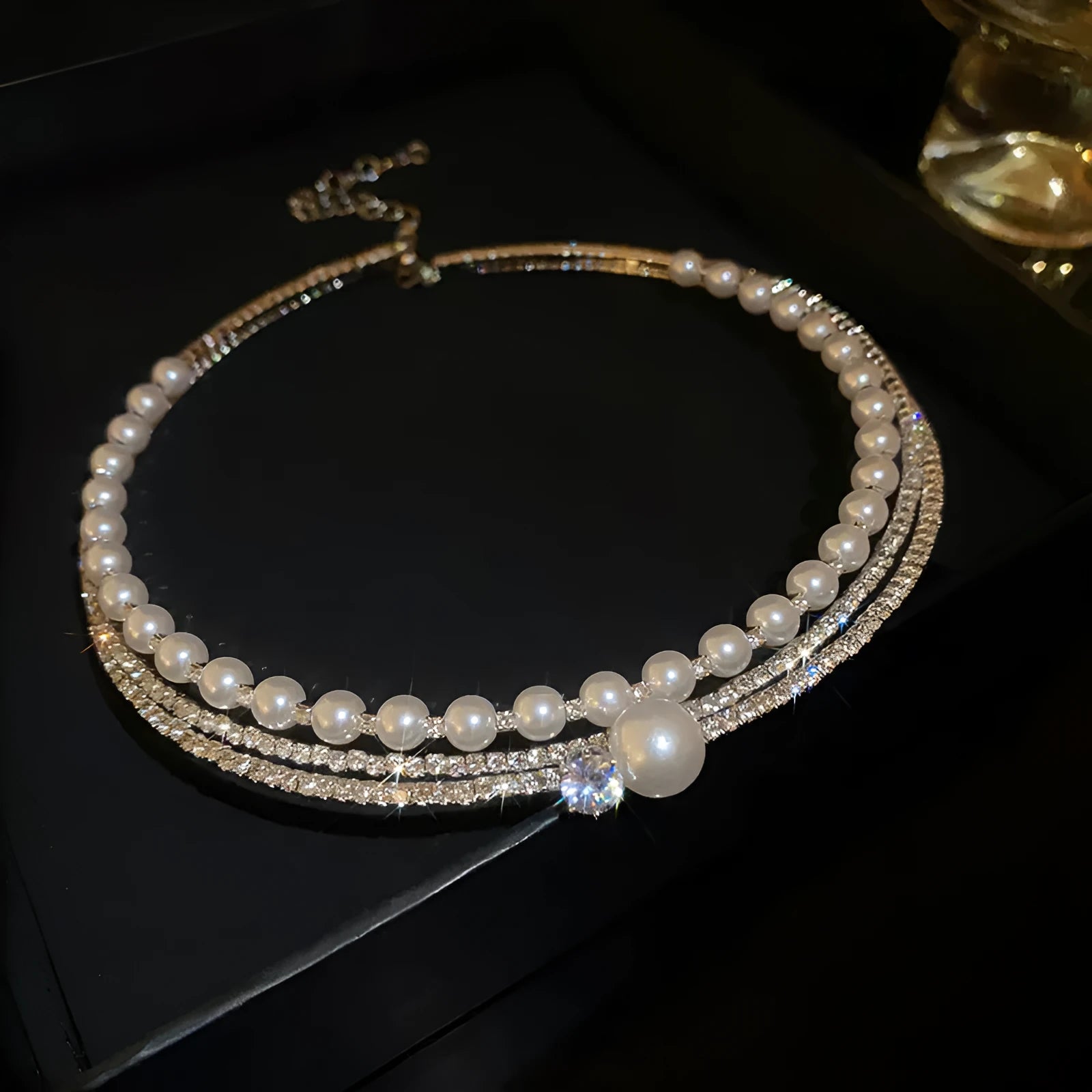 Round curved silver-tone geometric necklace designed to enhance collarbone area on female model