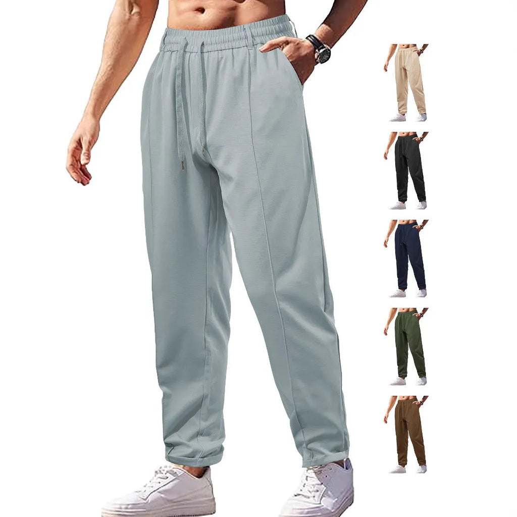 Men's high-waist drawstring casual trousers in cotton-like polyester fabric, available in six colours