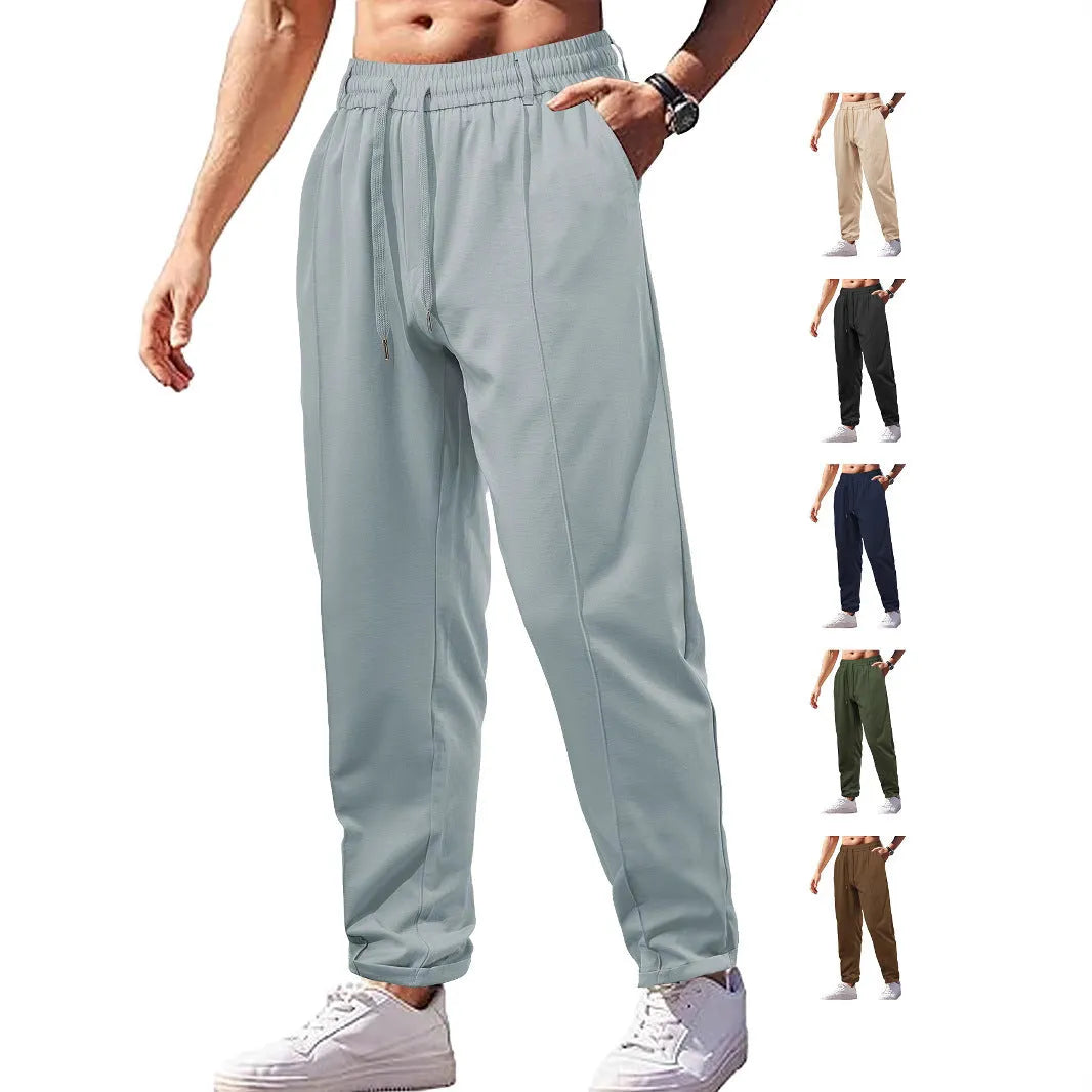 Men's high-waist drawstring casual trousers in cotton-like polyester fabric, available in six colours