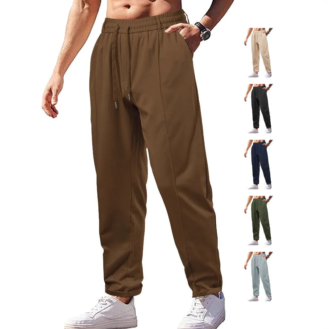 Men's high-waist drawstring casual trousers in cotton-like polyester fabric, available in six colours