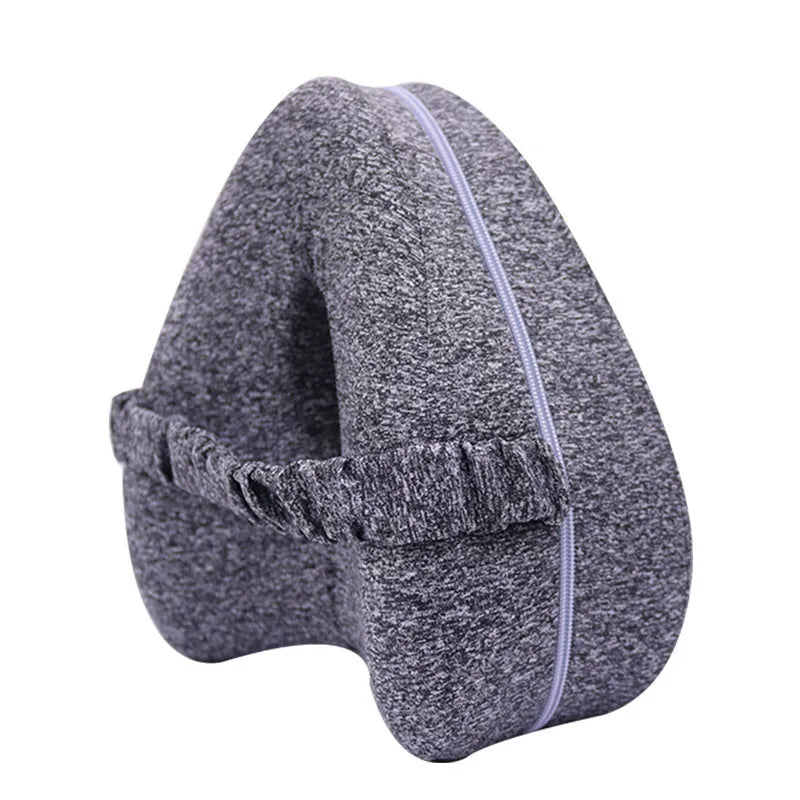 Love heart-shaped dark blue memory foam leg pillow for adult knee and leg support.