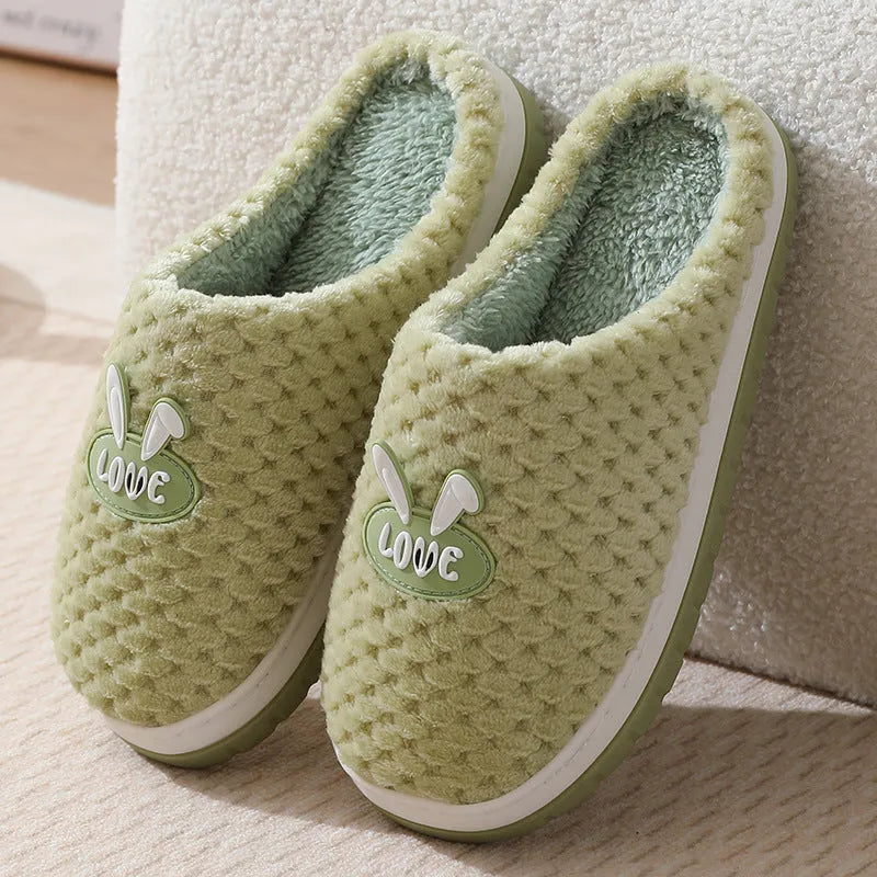 Rabbit plaid pattern women's house slippers with artificial fur upper and rubber sole.