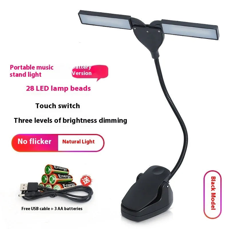 Black rechargeable music stand light with 28 LEDs clipped to metal music stand illuminating sheet music