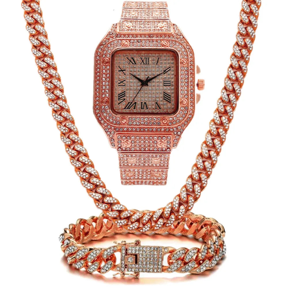 Gold Roman numeral quartz watch with diamond studs and black mesh band, with matching bracelet and necklace.