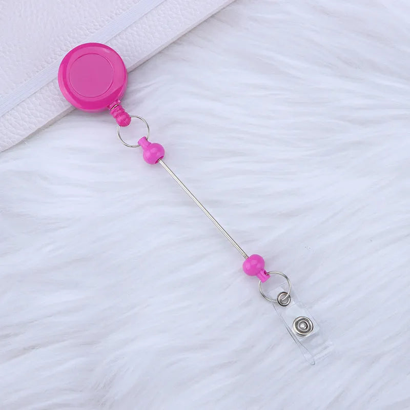 Plastic telescopic retractable keychain with anti-lost buckle, 16.6cm x 3.2cm, available in multiple colours