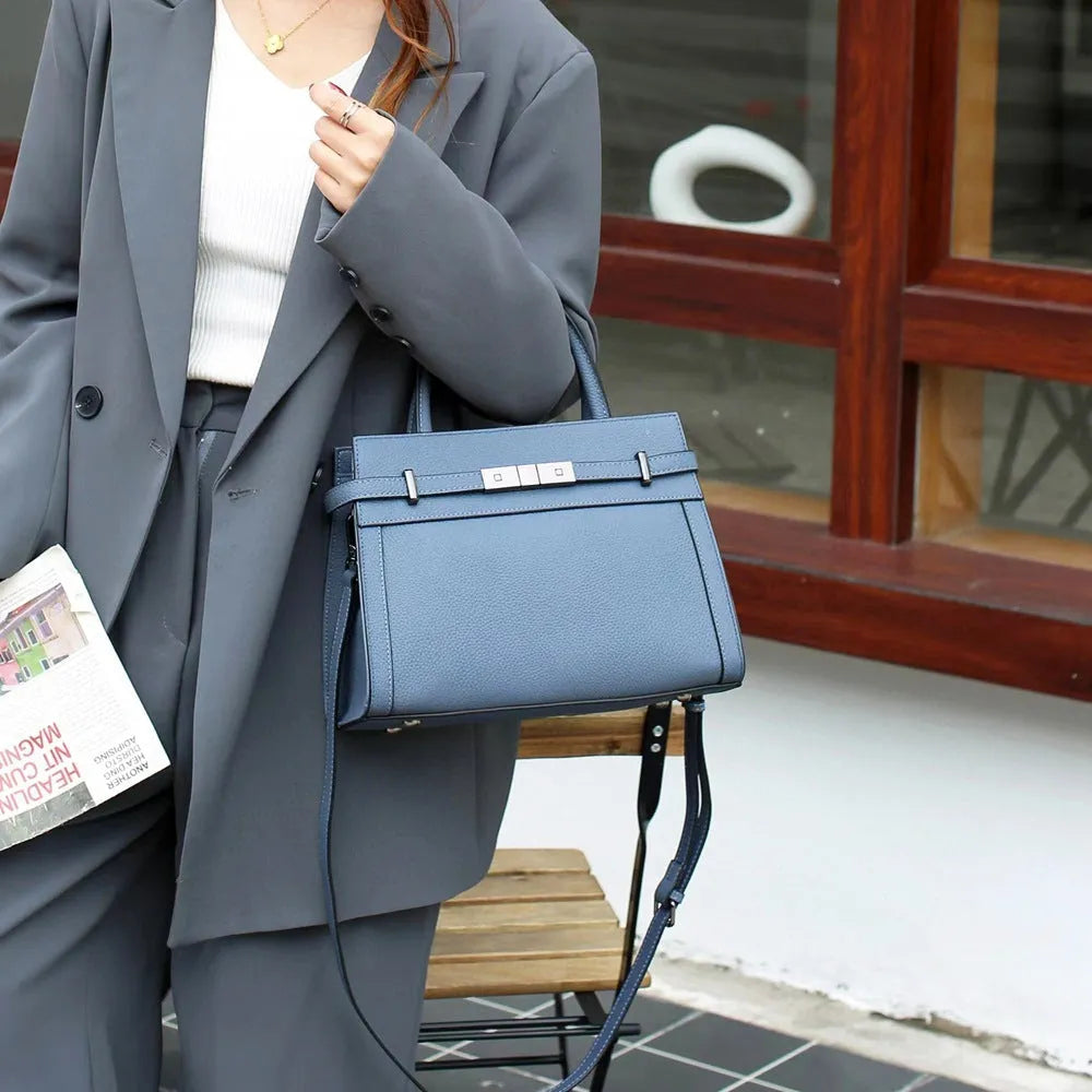 Genuine leather small square shoulder bag in almond green colour showing internal compartments