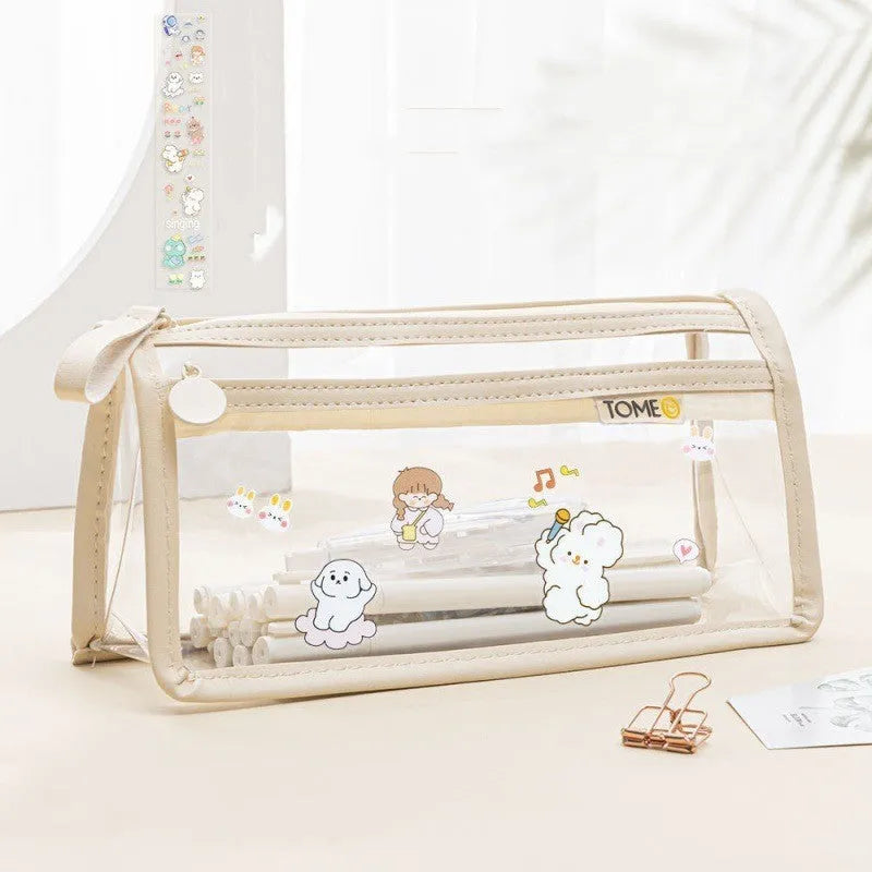 Large transparent double-layer pencil case in blue showing internal compartments, dimensions 220x110x80mm.