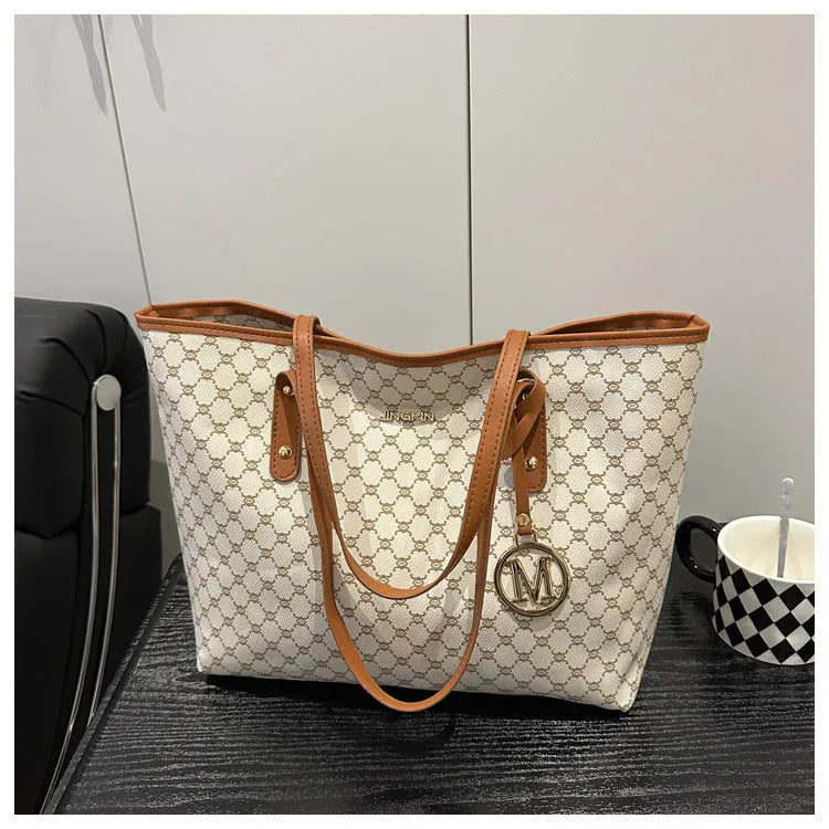 Black PU leather street-style shoulder bag with sewing thread detail, shown next to grey, brown, and white colour options.