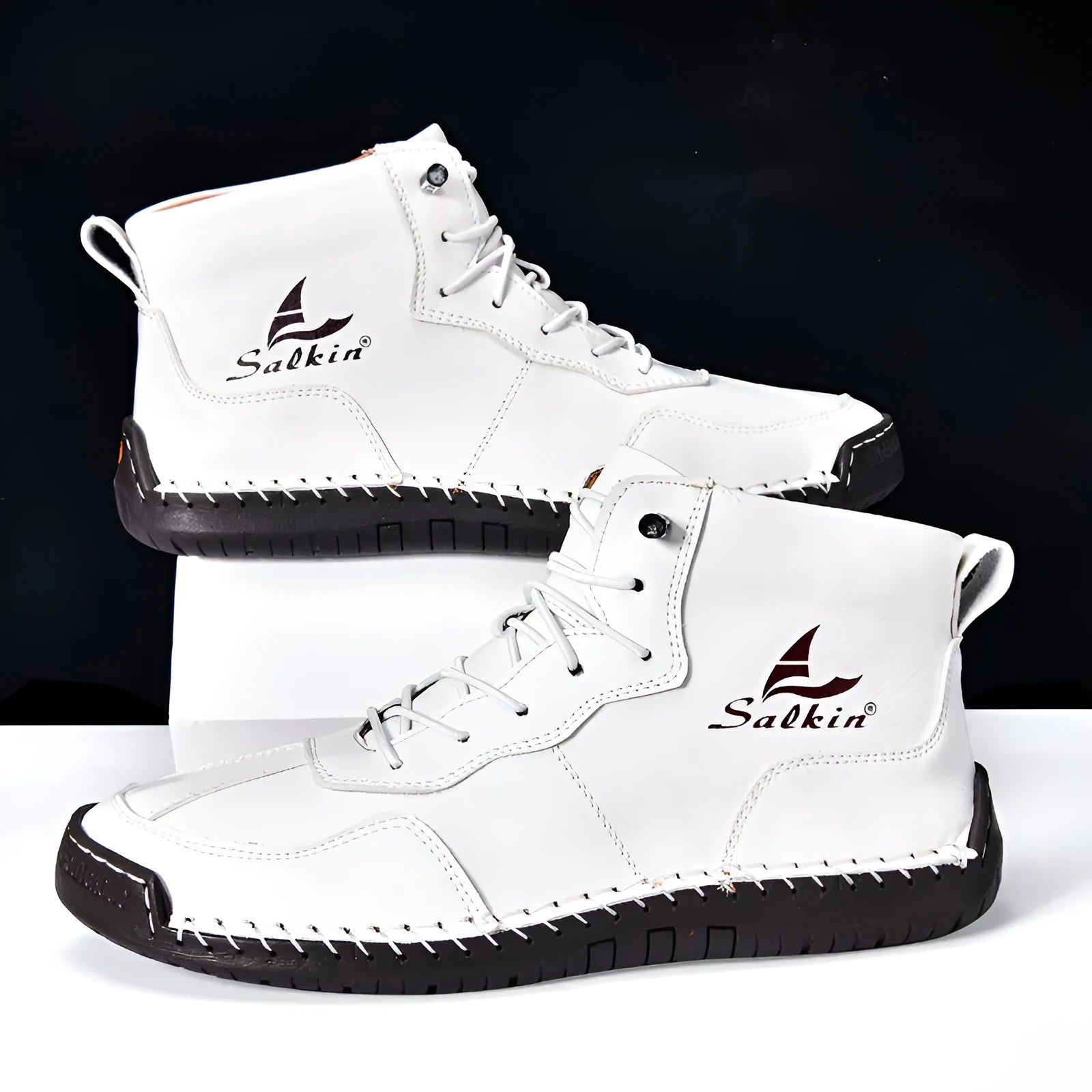 Casual high-top leather boots with elastic band closure and flat heel in beige colour with visible sewing detailing