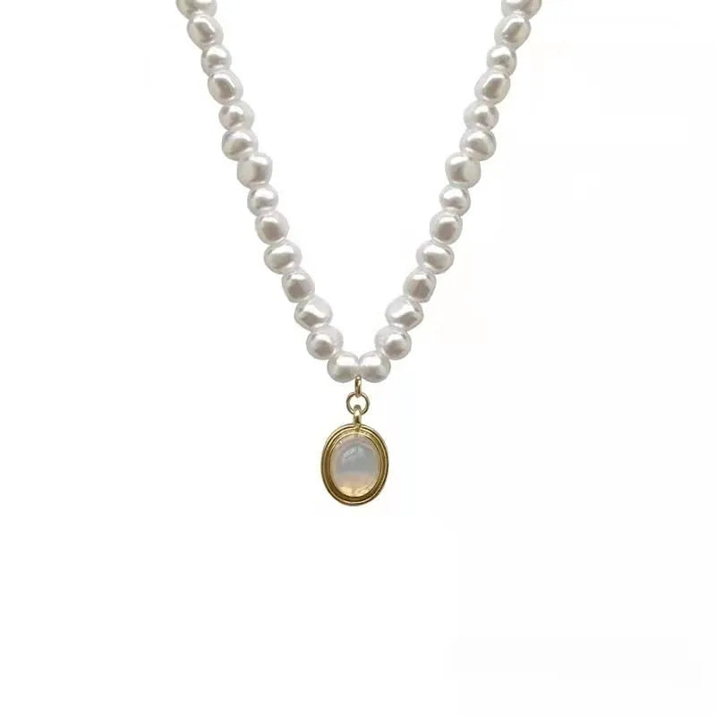 French Court style vintage pearl necklace with geometric shapes on an adjustable metal chain.