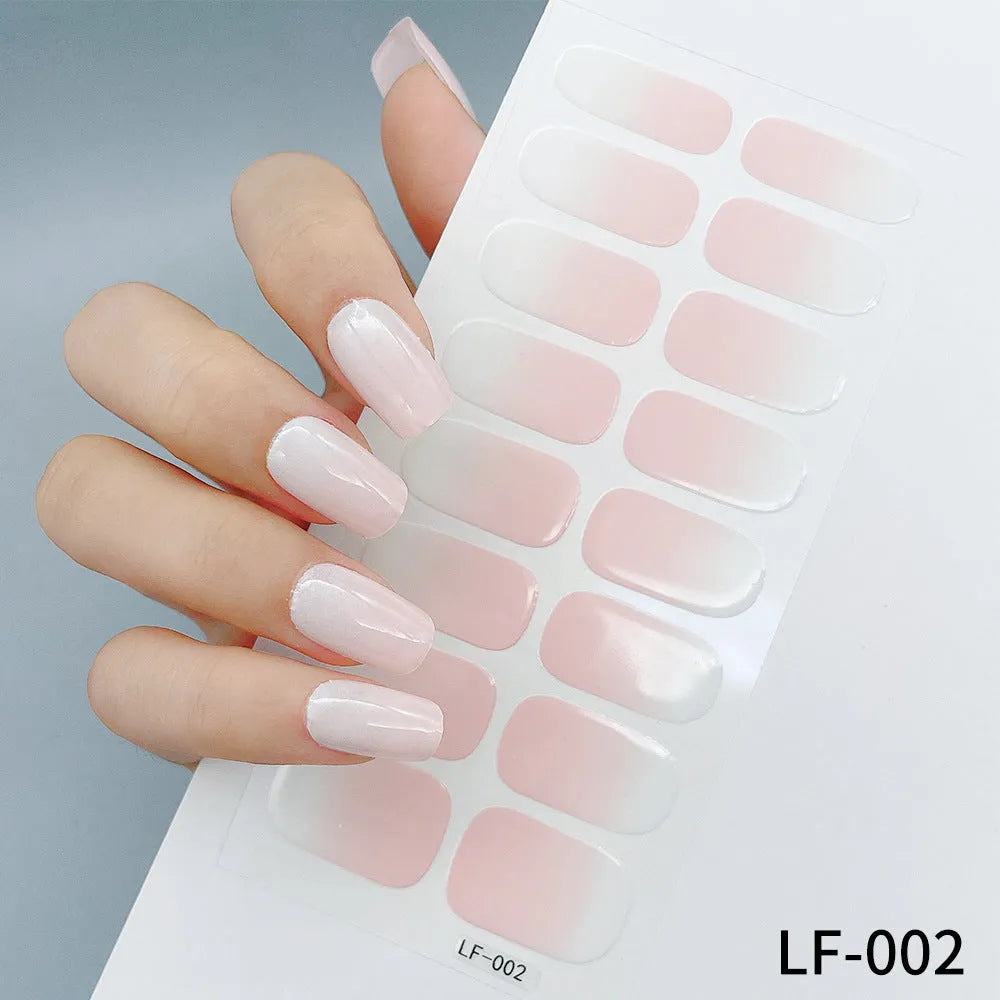 Set of 16 solid colour full nail art stickers showing patterns like cross, rose, tulip, and cartoon designs.