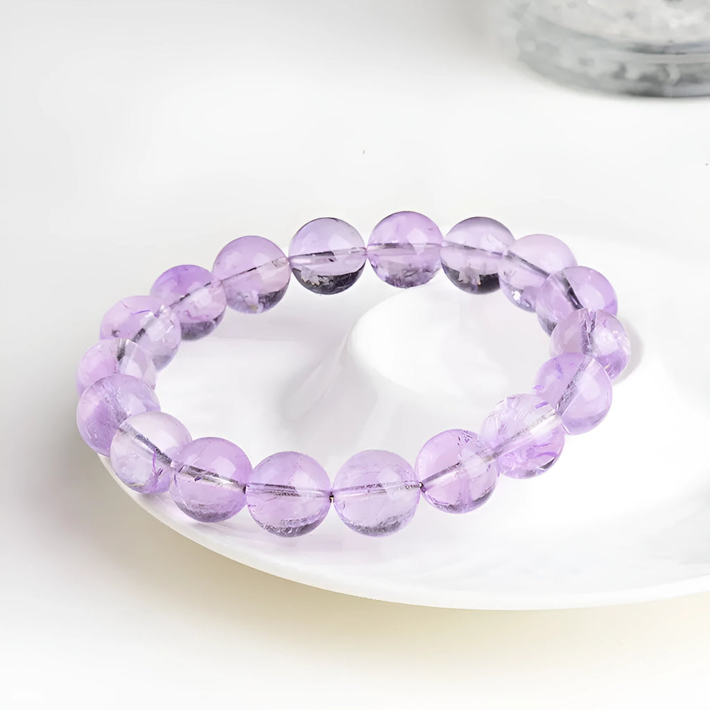 Lavender amethyst bracelet with water ripple texture on round beads in unisex design.