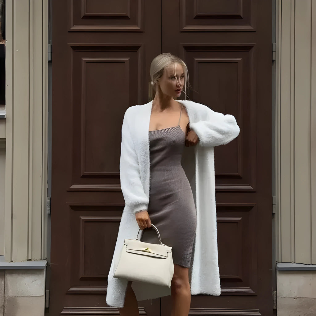 White longline knitted cardigan for women with a loose fit and long sleeves.