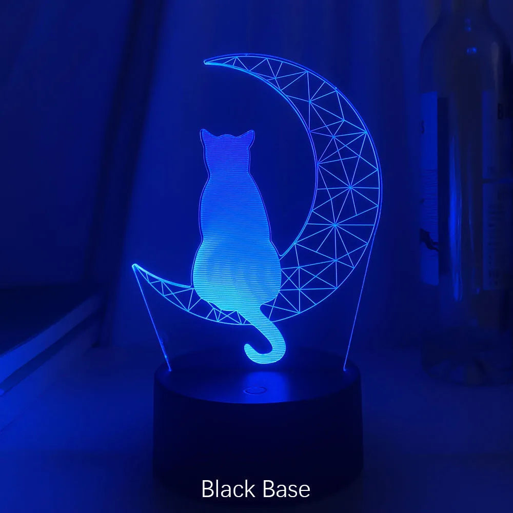 3D LED light moon and cat shape acrylic panel with remote control and USB cable on a dark surface