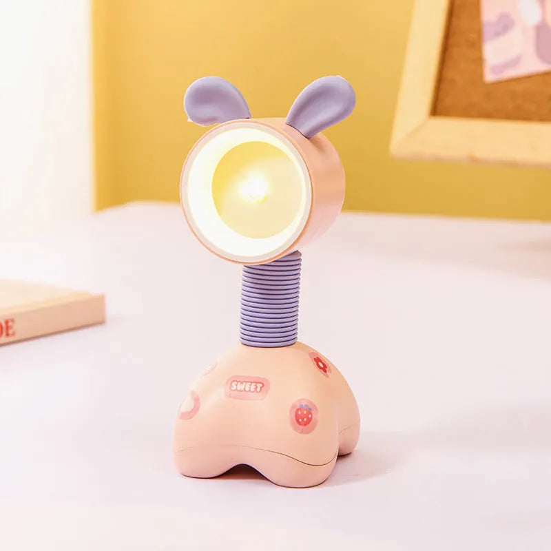 Cartoon animal magnetic night lamp with adjustable head on metallic surface