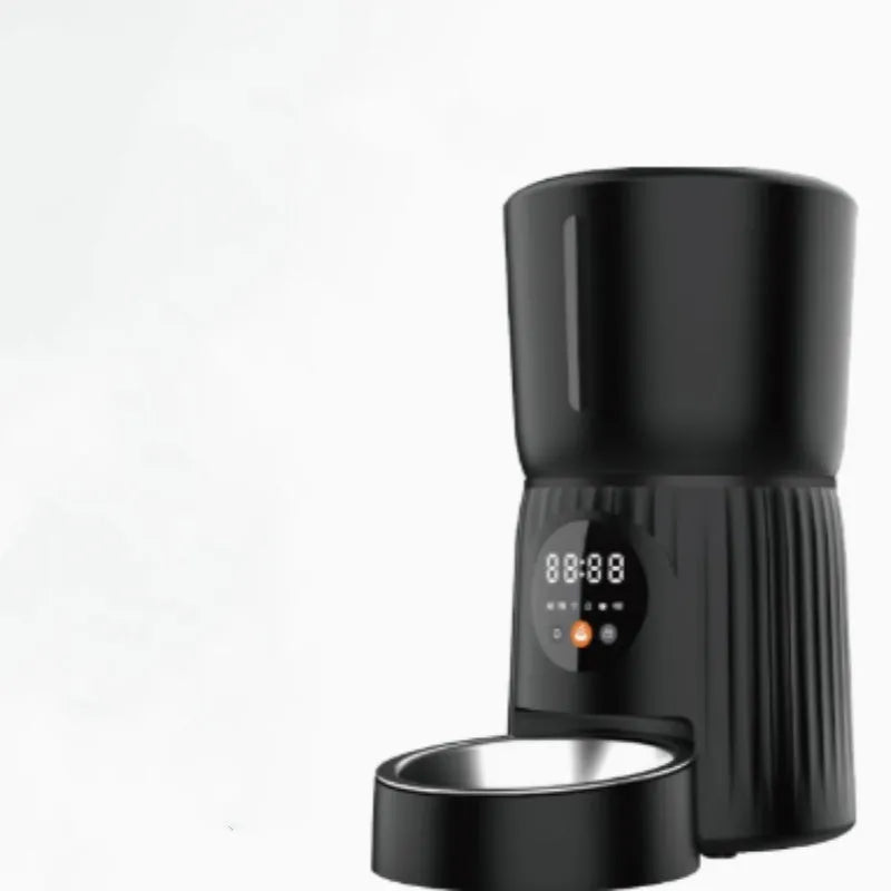 Black automatic pet feeder with digital display and food container showing portion control settings