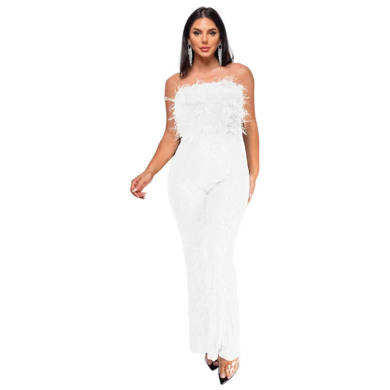 Women's sleeveless backless jumpsuit with flared legs in a champagne colour on a mannequin.