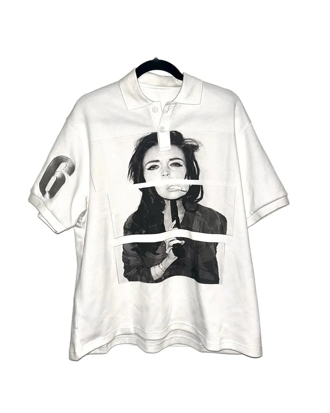Short-sleeved printed polo shirt in polyester fabric on a hanger