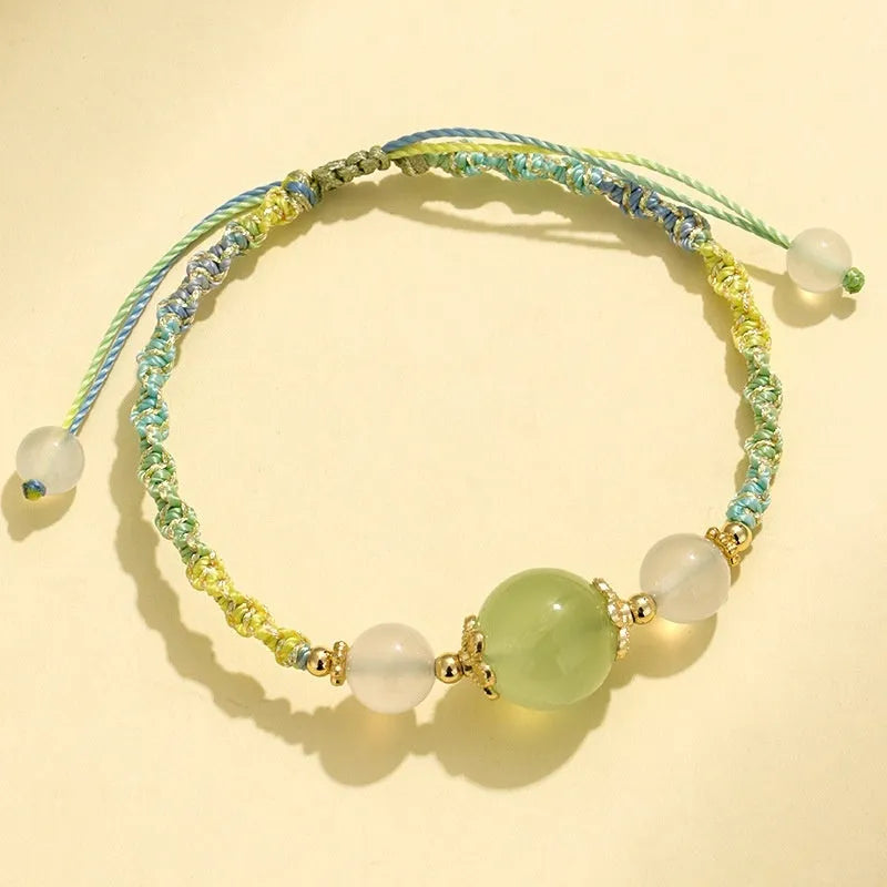 Hand-woven white agate and prehnite couple bracelet with 12mm diamond-shaped beads and electroplated finish on woman's wrist