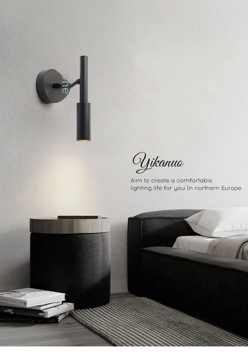 Modern minimalist wrought iron wall lamp in black or white with adjustable three-colour lighting.